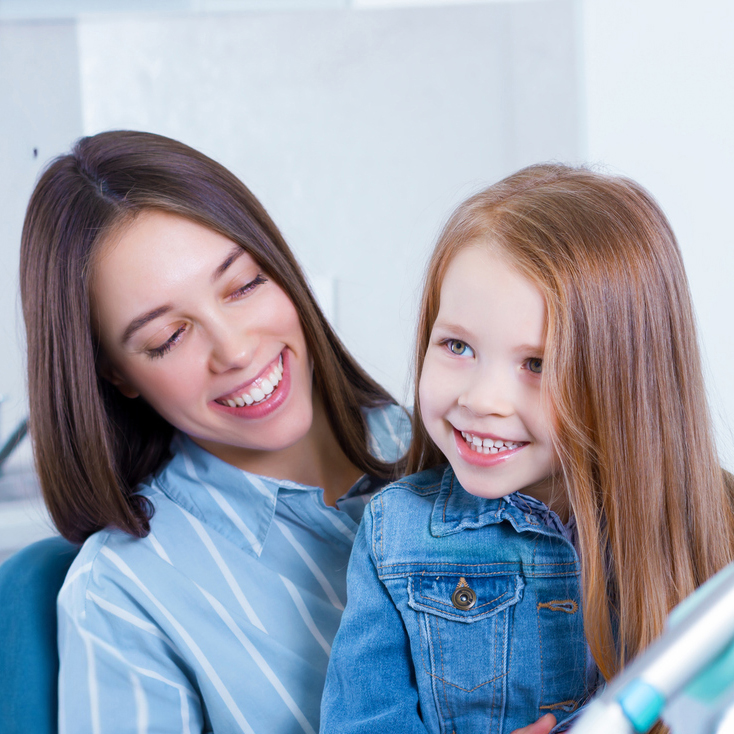 Smiling Mother And Daughter
